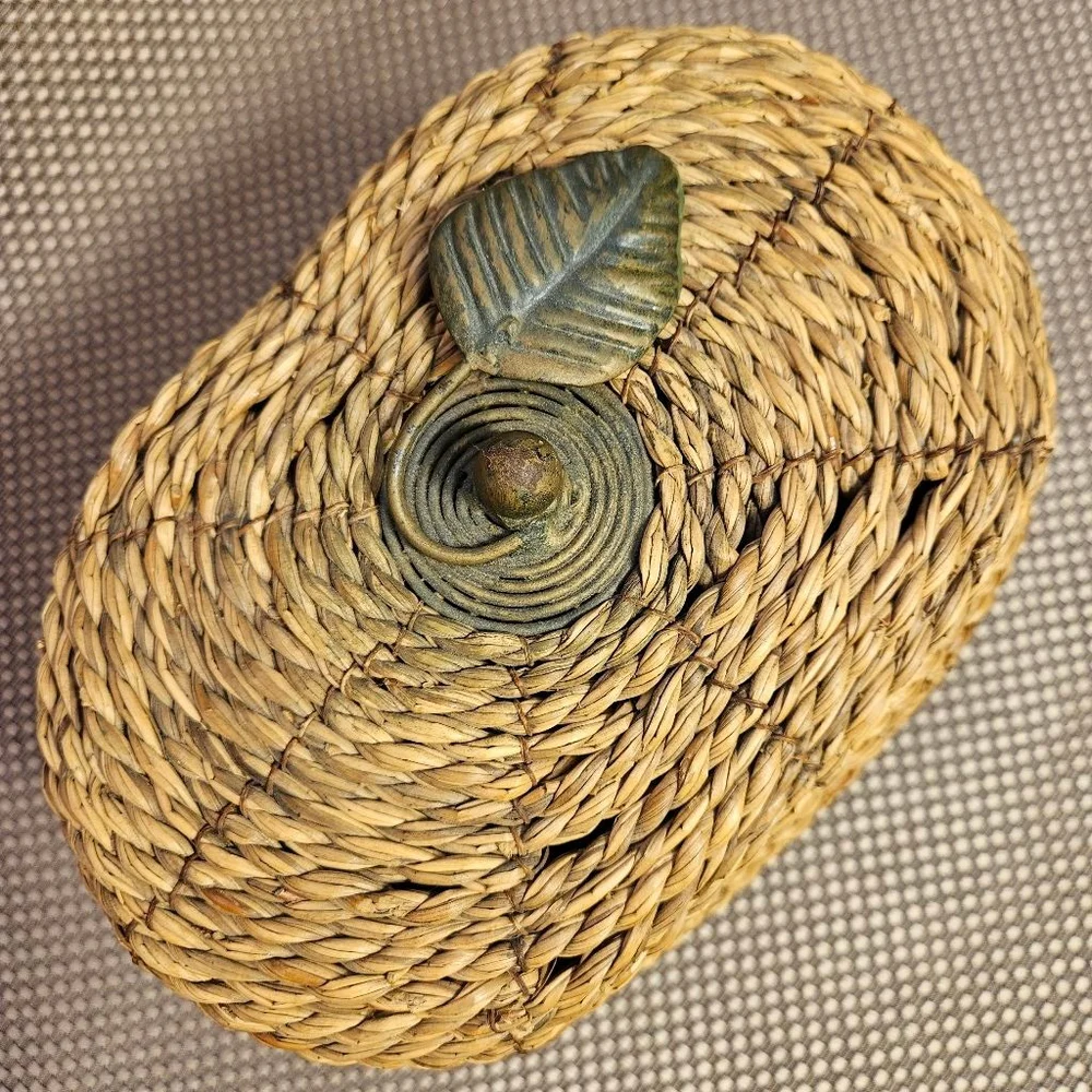 Vintage hand-woven coiled rye straw rattan wicker basket with metal leaf topper